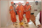 Swamishri entering Luton Mandir