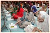 Ladies from Southend-on-Sea Mandal participate in the mahapuja vidhi