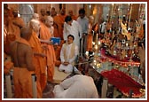 Swamishri rocks Harikrishna Maharaj on a beautiful hindolo decorated with miniature musical instruments