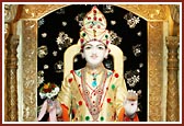 Ghanshyam Maharaj adorned with colourful rakhdis