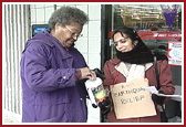 BAPS volunteers collecting funds for India Earthquake 
