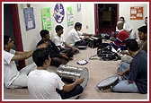 Final rehearsal of kirtans (devotional songs) for Shibir  