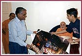 Chicago Annakut details were presented before Swamishri 