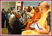 Swamishri individually meets all of the attendees