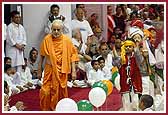 Balaks joyously dance next to Swamishri