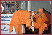 Swamishri is greeted by Pujya Yagnavallabh Swami