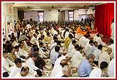 Devotees participating in the murti pratishtha ceremony