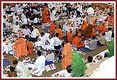 Swamishri, saints, and devotees perform the mahapooja for the Shilanyas Vidhi 
