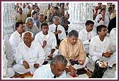 Devotees take part in the Mahapuja Vidhi