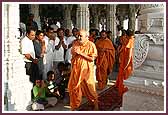 Swamishri walks through the Mandir pradikshina while having darshan 