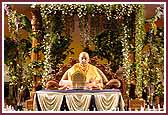  Swamishri performs his morning pooja in a garden setting  
