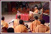 Swamishri performs mala as saints sing kirtans during Swamishri's morning puja  