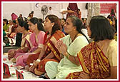 Devotees participating in the mahapuja ceremony  