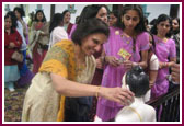  Devotees perform the abhishek rituals