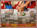 Devotees place bricks in the foundation