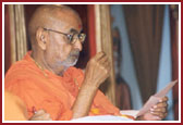 Swamishri deeply involved in reading letters from devotees 