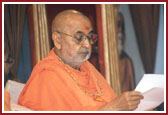 Swamishri deeply involved in reading letters from devotees