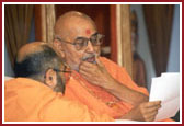 Swamishri deeply involved in reading letters from devotees