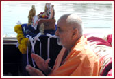 Shri Harikrishna Maharaj, Lord Ganeshji, Swamishri and saints observing the traditional boat ride.