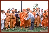 Swamishri sanctifies and inquires about the proposed land for a new mandir