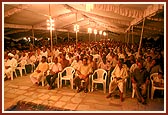 Evening satsang assembly in a marquee