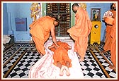 Offering prostrations to the murtis