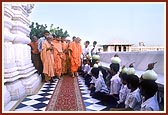 Blessing children with White Gourd on their head