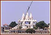 Mandir and construction project with Akshar Ghat in the foreground