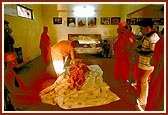 Swamishri engaged in darshan and prostrations in the sanctified room where Shastriji Maharaj resided 