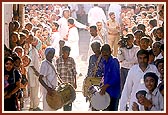 Drummers joyously beat the drums to evoke a festive flair