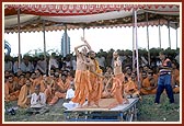 ... sadhus dance joyously while singing a kirtan