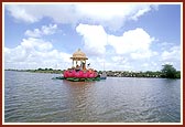  In the middle of river Utavali, Swamishri is with Shri Harikrishna Maharaj on a beautiful lotus-shaped stage