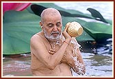 Swamishri takes the customary bath