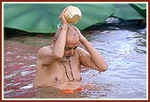 Swamishri takes the customary bath