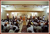 Devotees perform the murti pratishtha arti